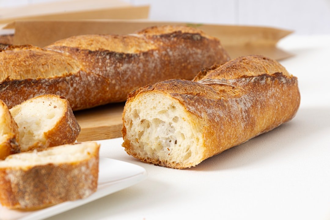 freshly-baked-baguettes-on-a-white-table-byza8rkf2uu